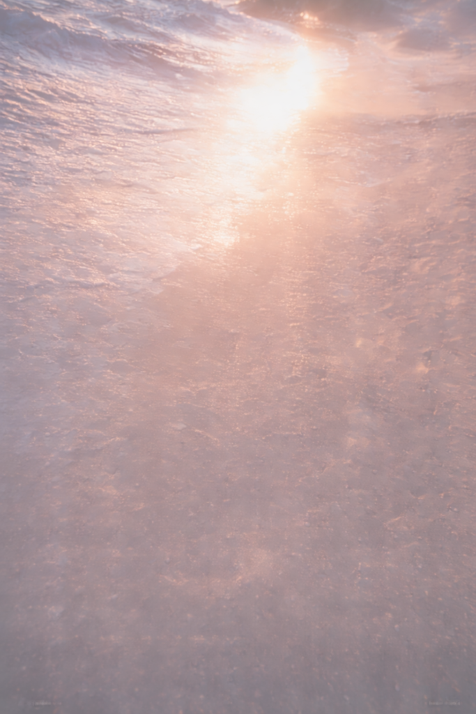 beach gleams like a new spoon at sunrise